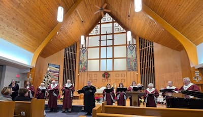 Faith Lutheran's voice choir sing in front of the altar.